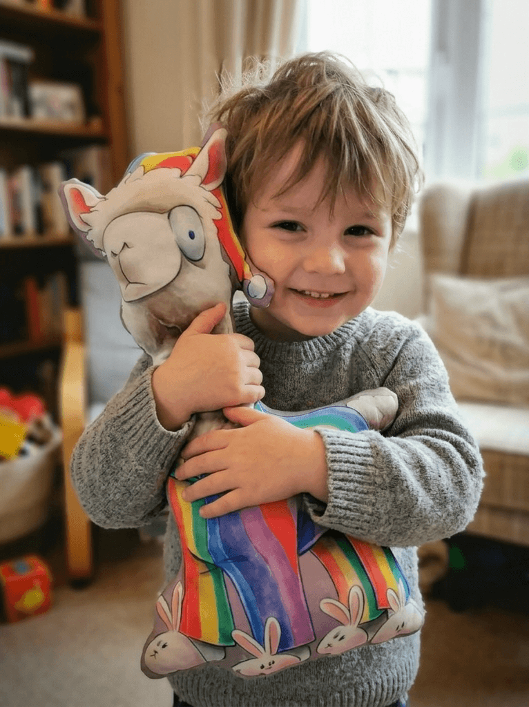 Kind wat 'n StorieTjommie vashou